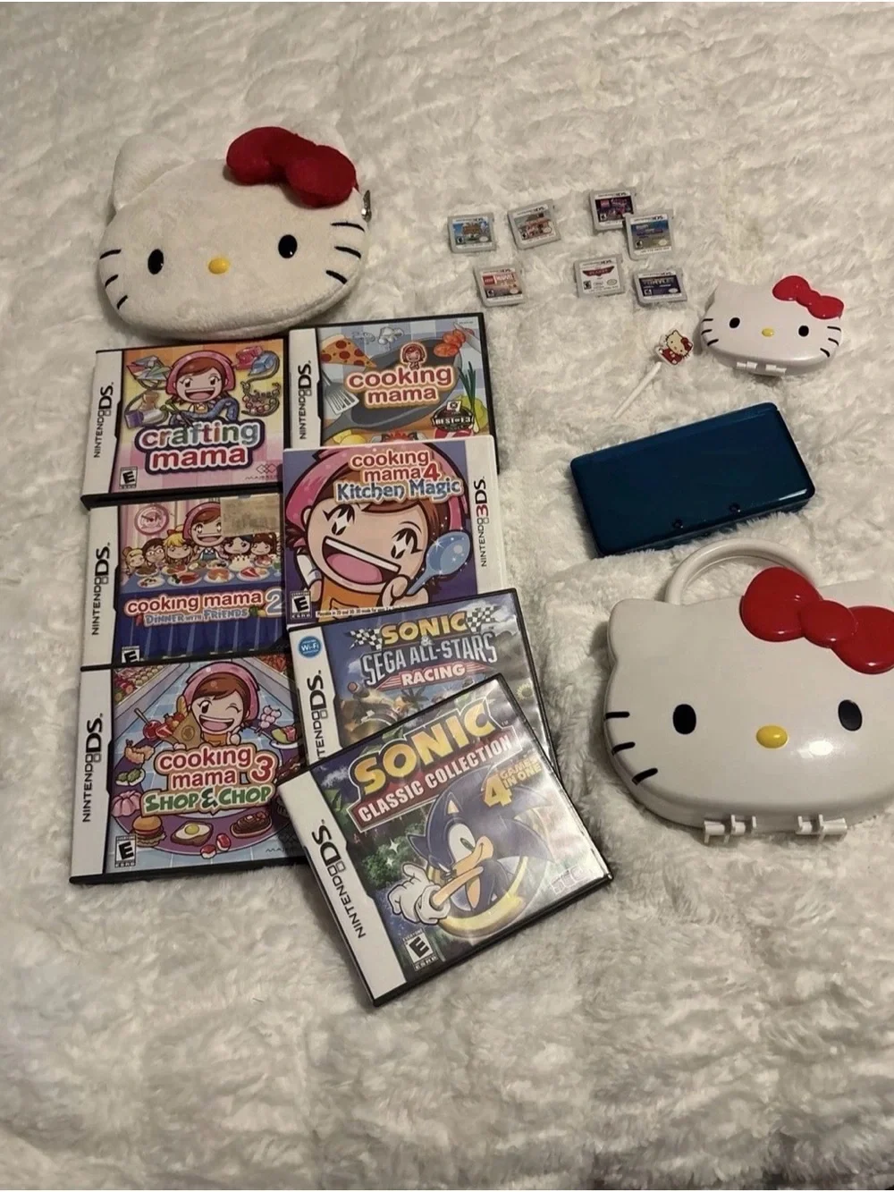 Nintendo Hello Kitty DS Bundle with Blue Handheld & Red-Accented Case